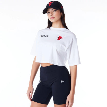 The Female model is wearing Chicago Bulls Womens NBA Team Logo Wordmark White Crop T-Shirt 5