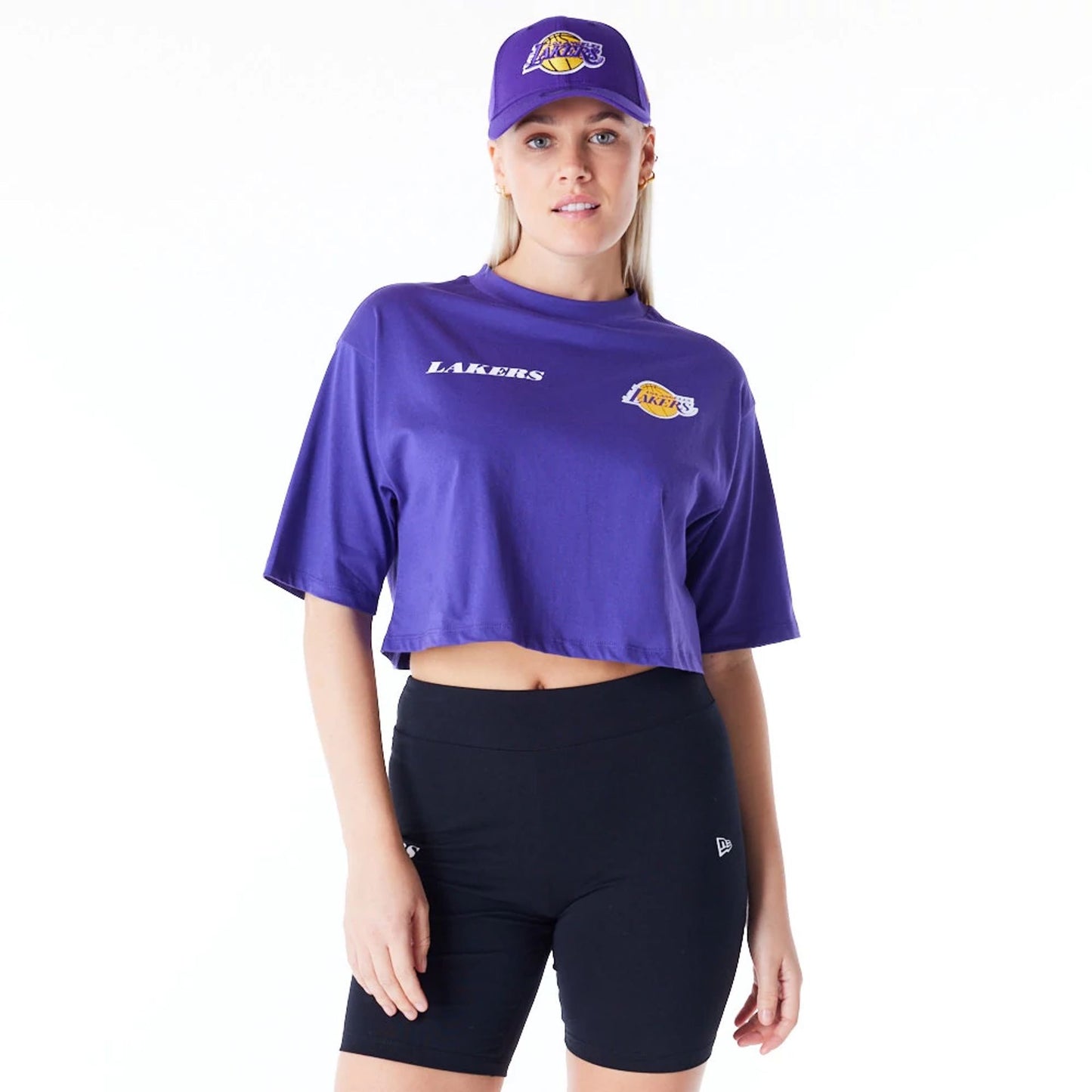 The Female model is wearing LA Lakers Womens NBA Team Logo Wordmark Purple Crop T-Shirt 1