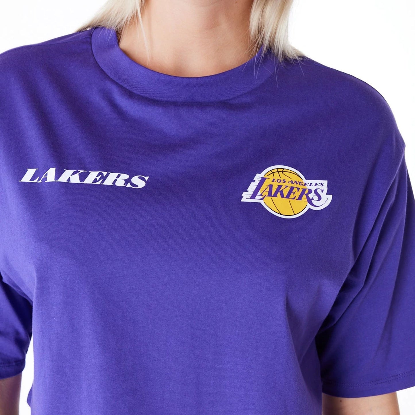 The Female model is wearing LA Lakers Womens NBA Team Logo Wordmark Purple Crop T-Shirt 2