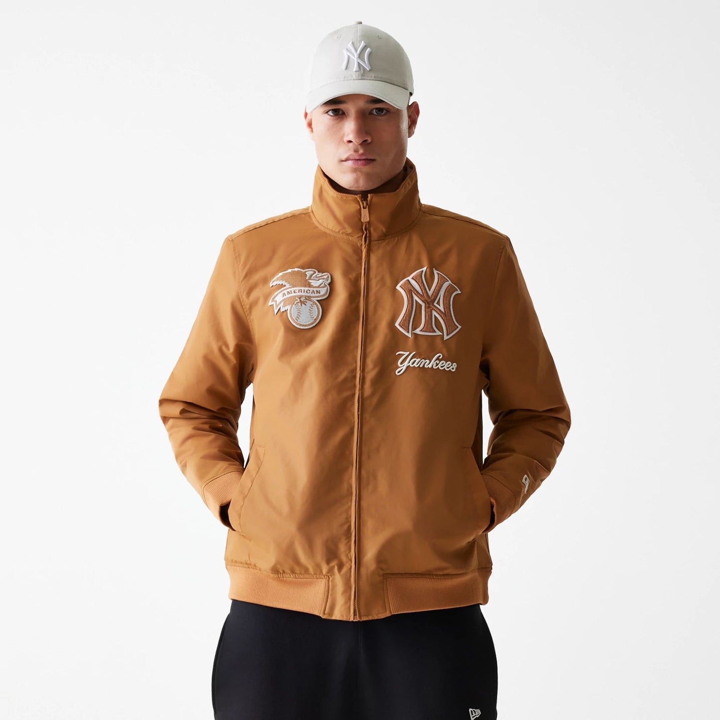 The Male model is wearing New York Yankees Logo Select Fashion Beige Full Zip Jacket 1