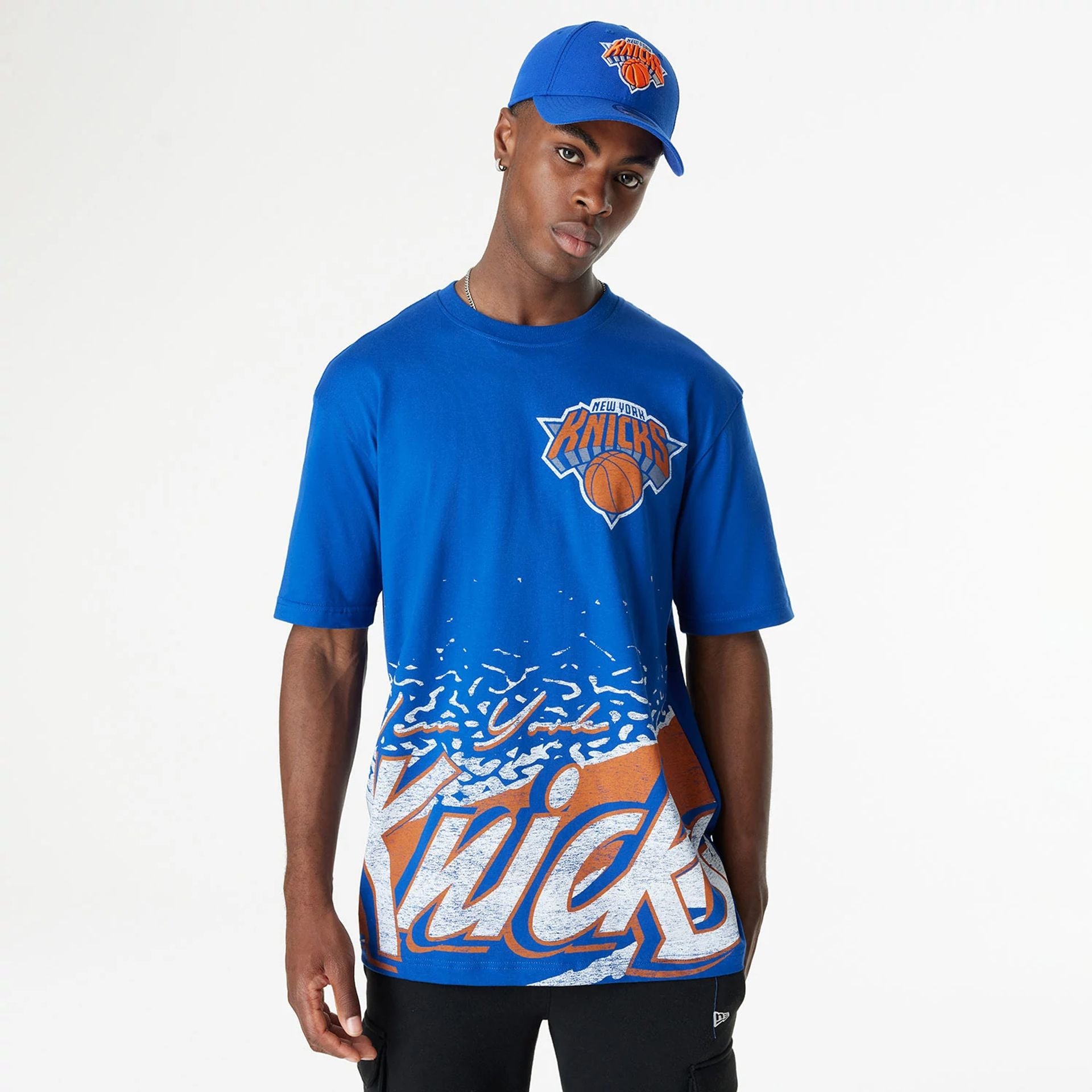 The Male model is wearing New York Knicks Sport Classic Blue T-Shirt 1