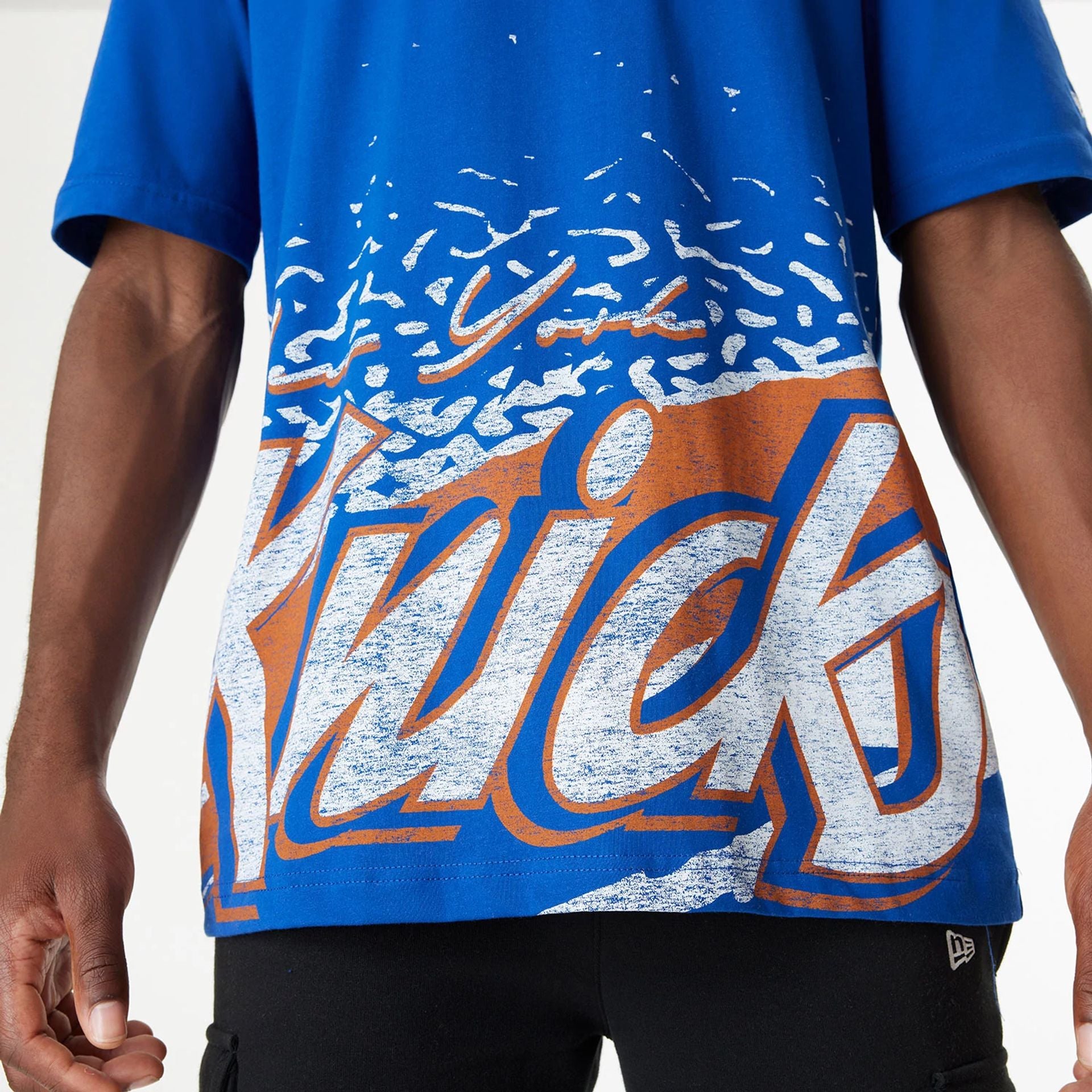 The Male model is wearing New York Knicks Sport Classic Blue T-Shirt 3