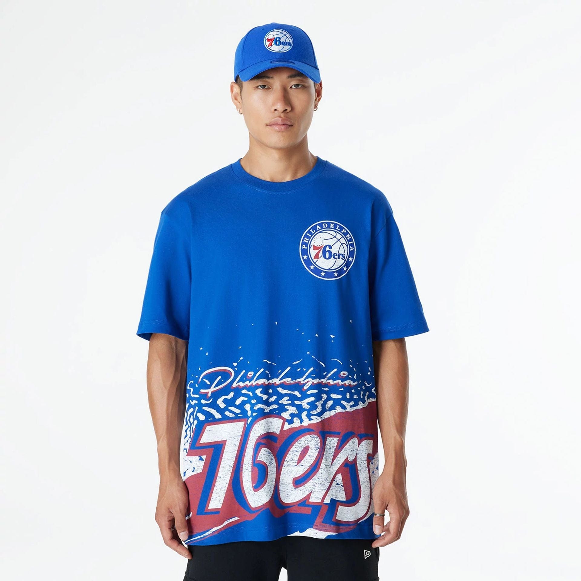 The Male model is wearing Philadelphia 76ers Sport Classic Blue T-Shirt 1