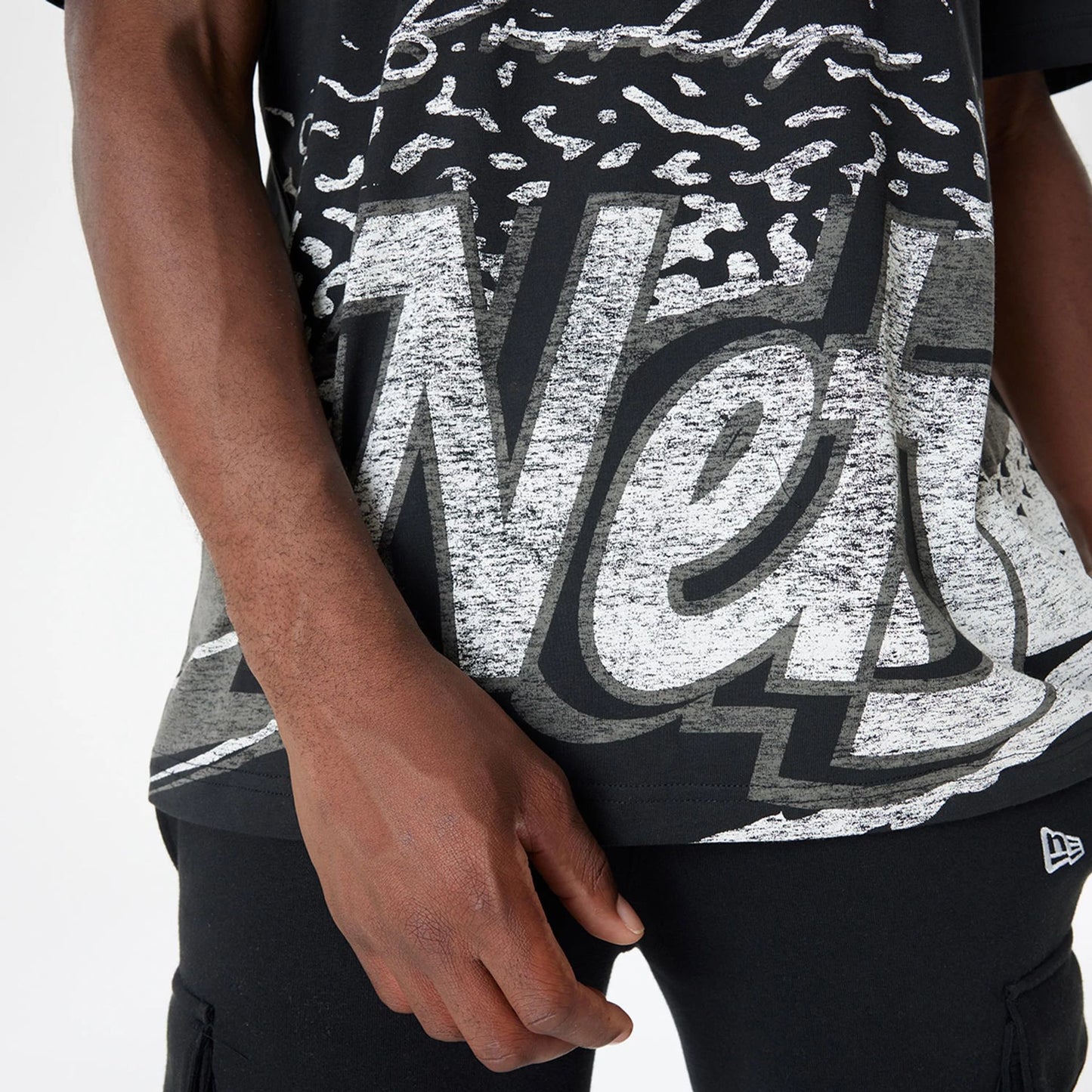 The Male model is wearing Brooklyn Nets Sport Classic Black T-Shirt 6