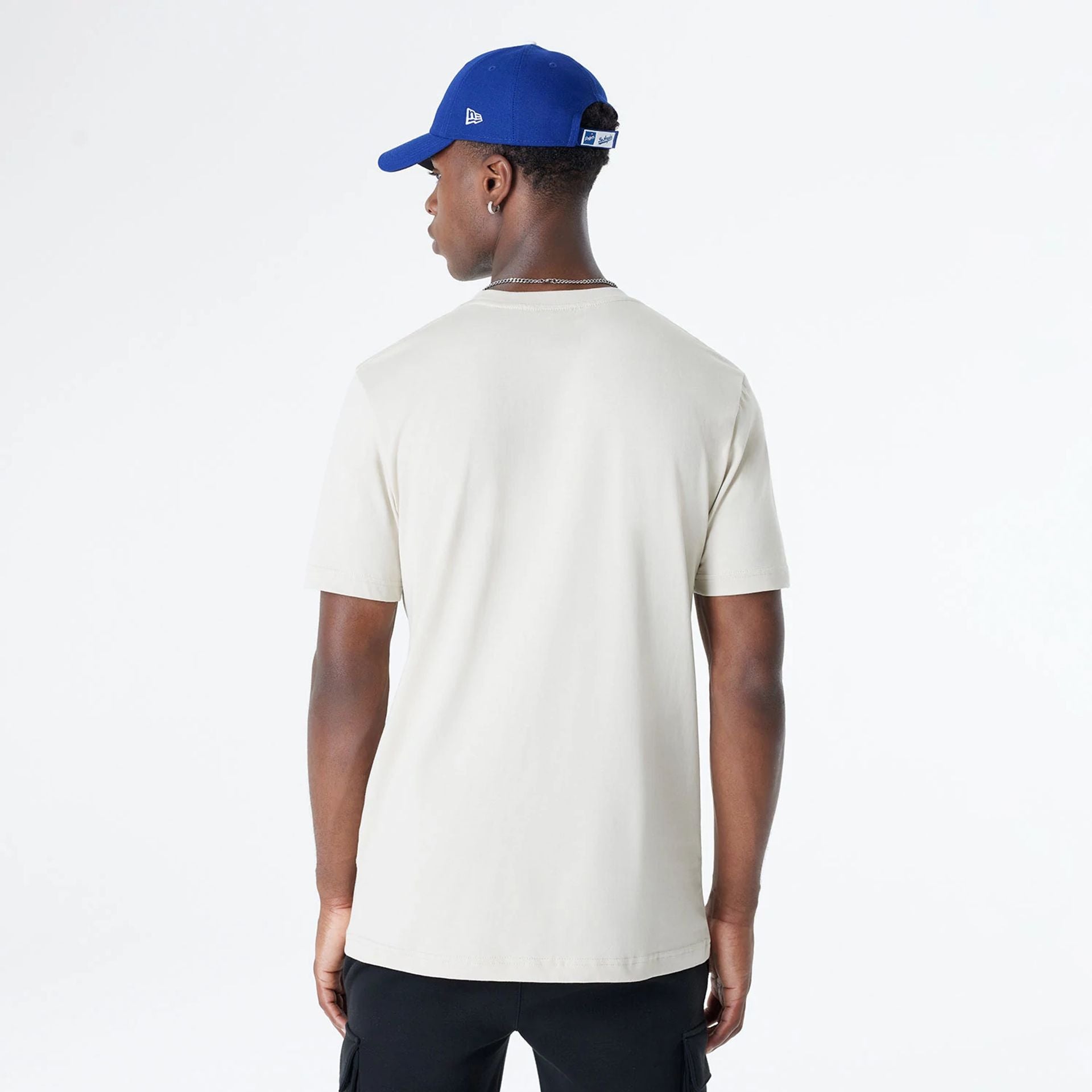 The Male model is wearing LA Dodgers Official Doodles Light Beige T-Shirt 2