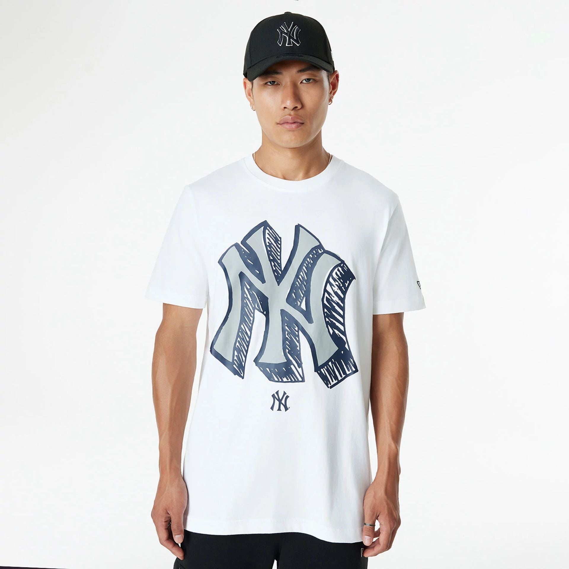 The Male model is wearing New York Yankees Official Doodles White T-Shirt 1