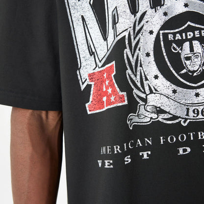 The Male model is wearing Las Vegas Raiders Oversized Essential Black Oversized T-Shirt 6