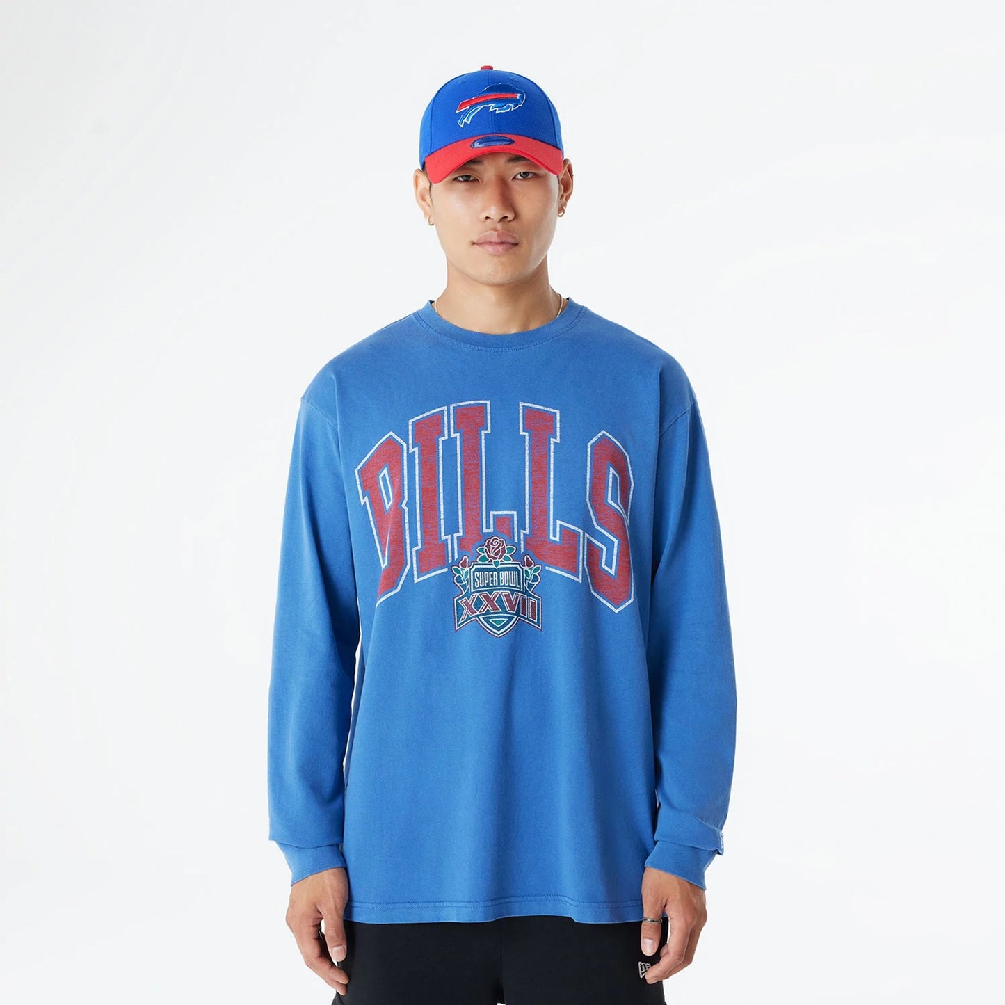 The Male model is wearing Buffalo Bills Oversized Essential Blue Oversized Long Sleeve T-Shirt 1