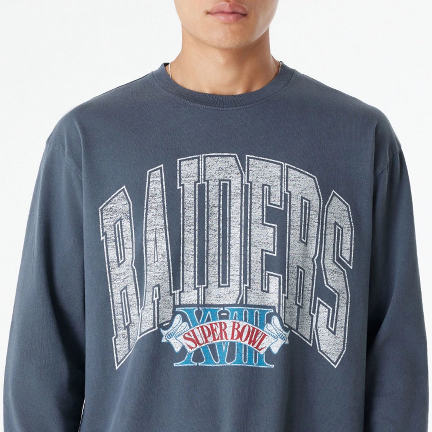 The Male model is wearing Las Vegas Raiders Oversized Essential Dark Grey Oversized Long Sleeve T-Shirt 3