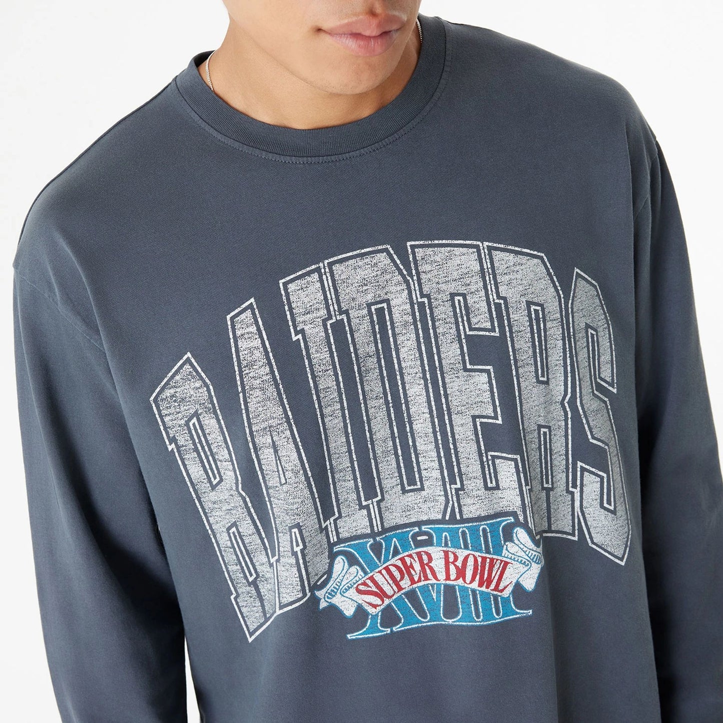 The Male model is wearing Las Vegas Raiders Oversized Essential Dark Grey Oversized Long Sleeve T-Shirt 6