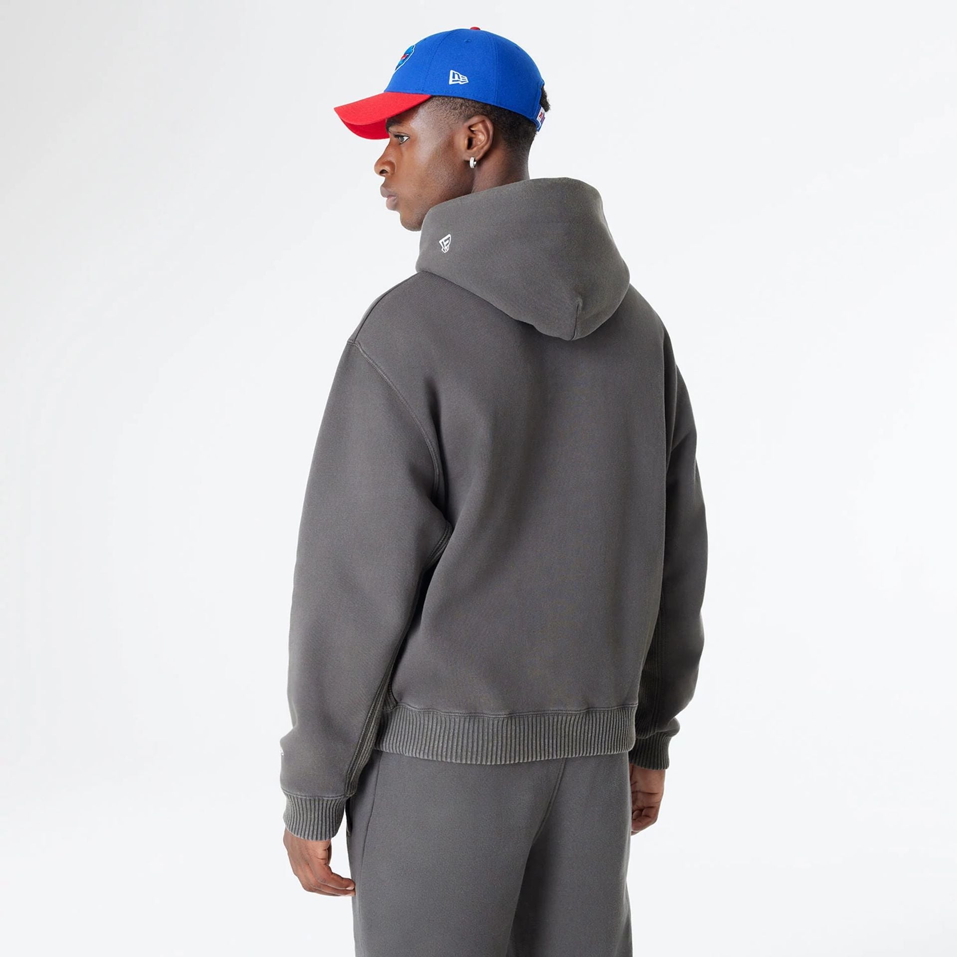 The Male model is wearing Buffalo Bills Oversized Essential Dark Grey Oversized Pullover Hoodie 2