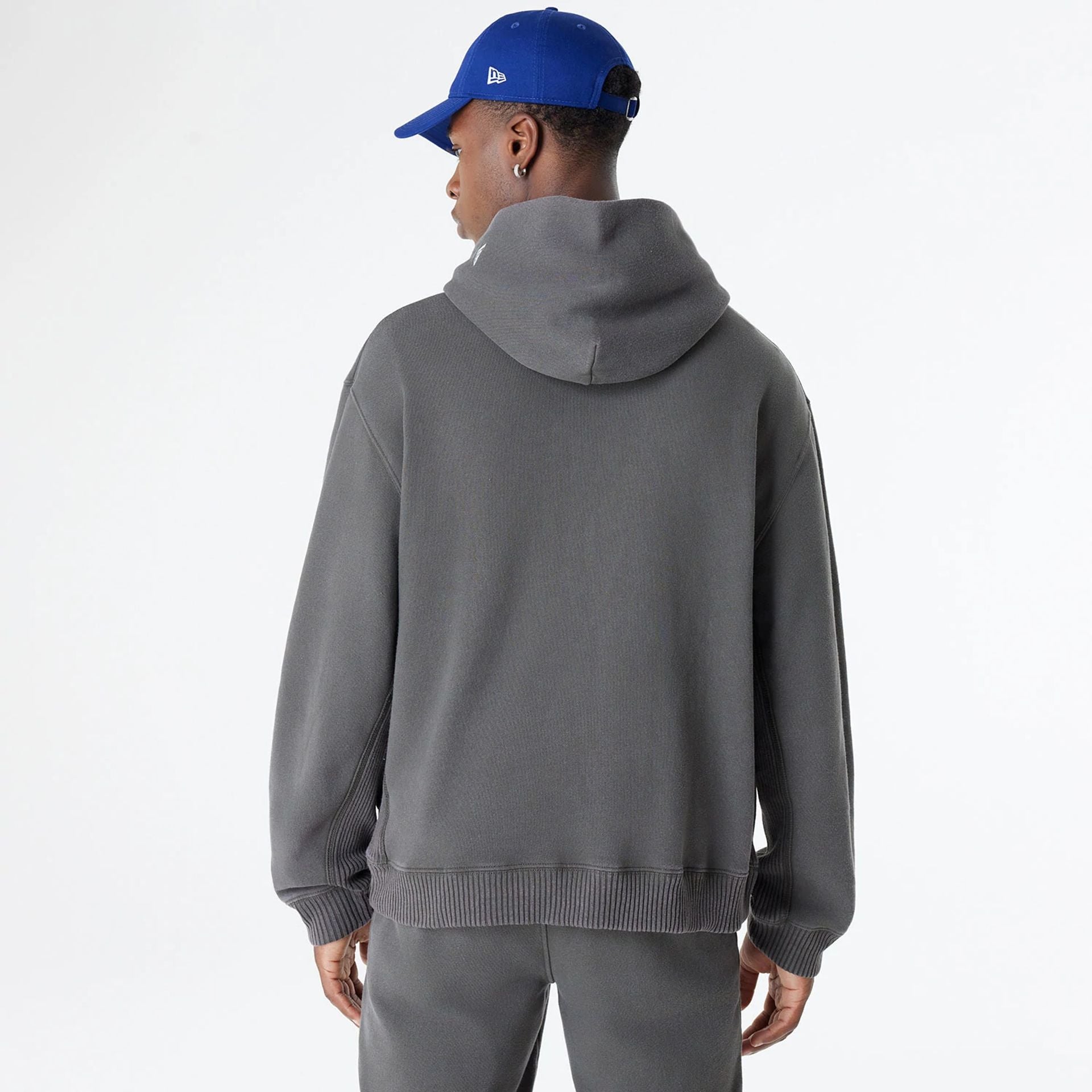 The Male model is wearing LA Dodgers Oversized Essential Dark Grey Oversized Pullover Hoodie 2