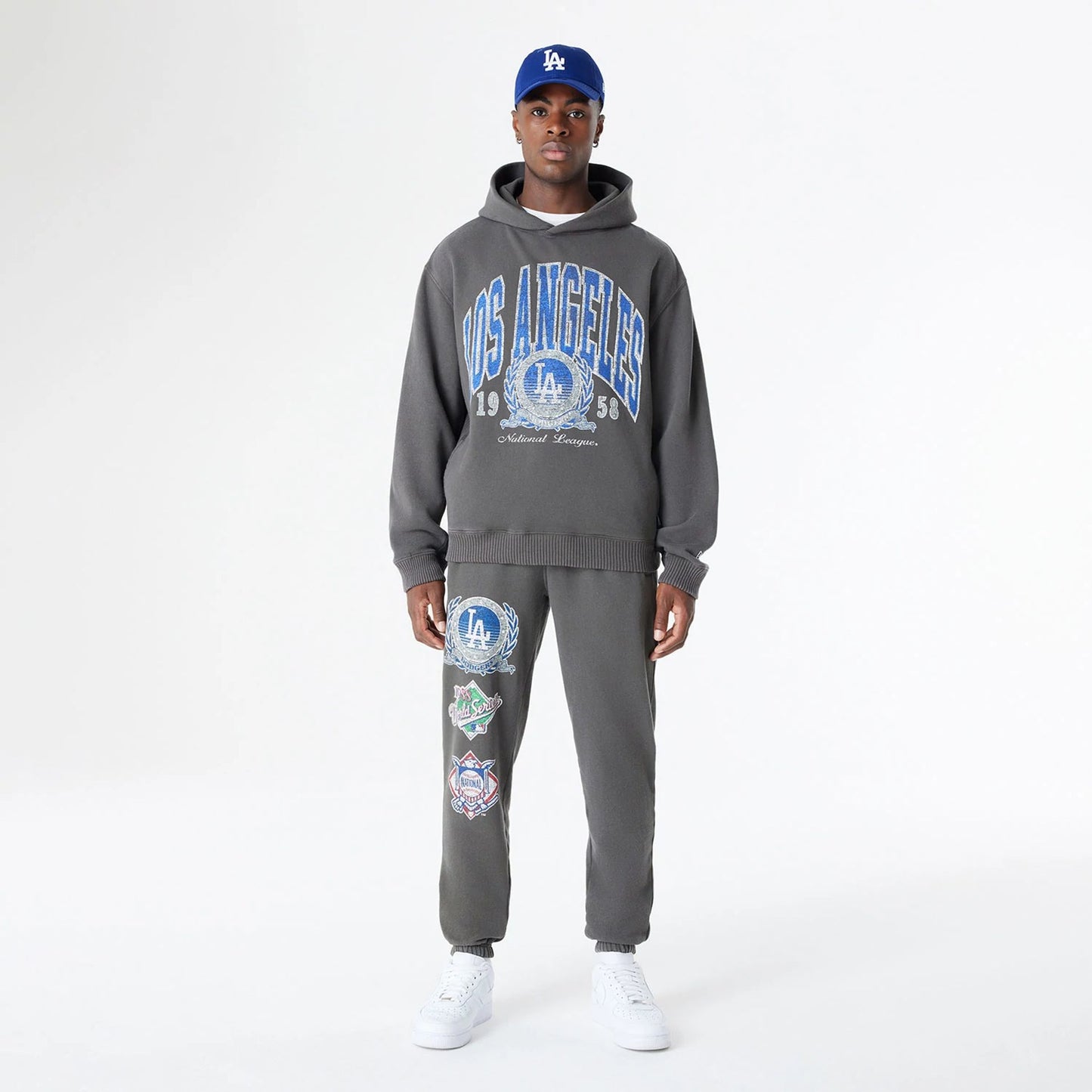 The Male model is wearing LA Dodgers Oversized Essential Dark Grey Oversized Pullover Hoodie 7