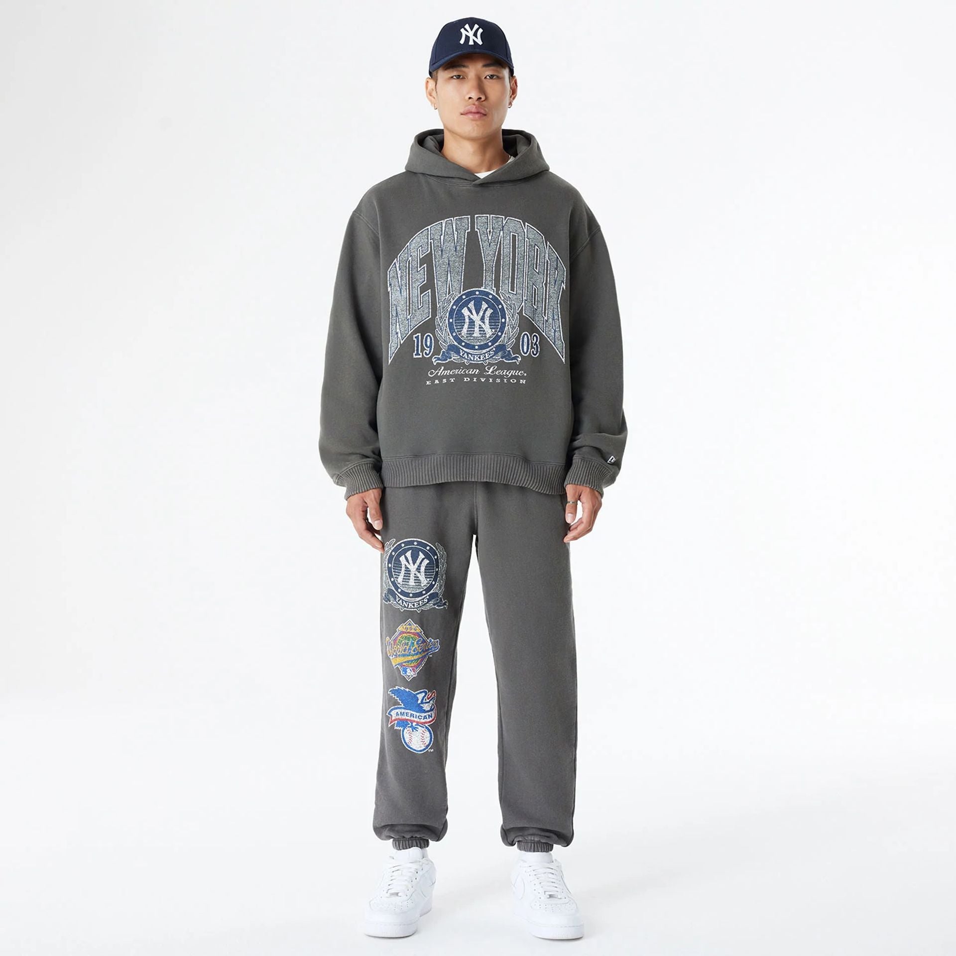 The Male model is wearing New York Yankees Oversized Essential Dark Grey Oversized Pullover Hoodie 8