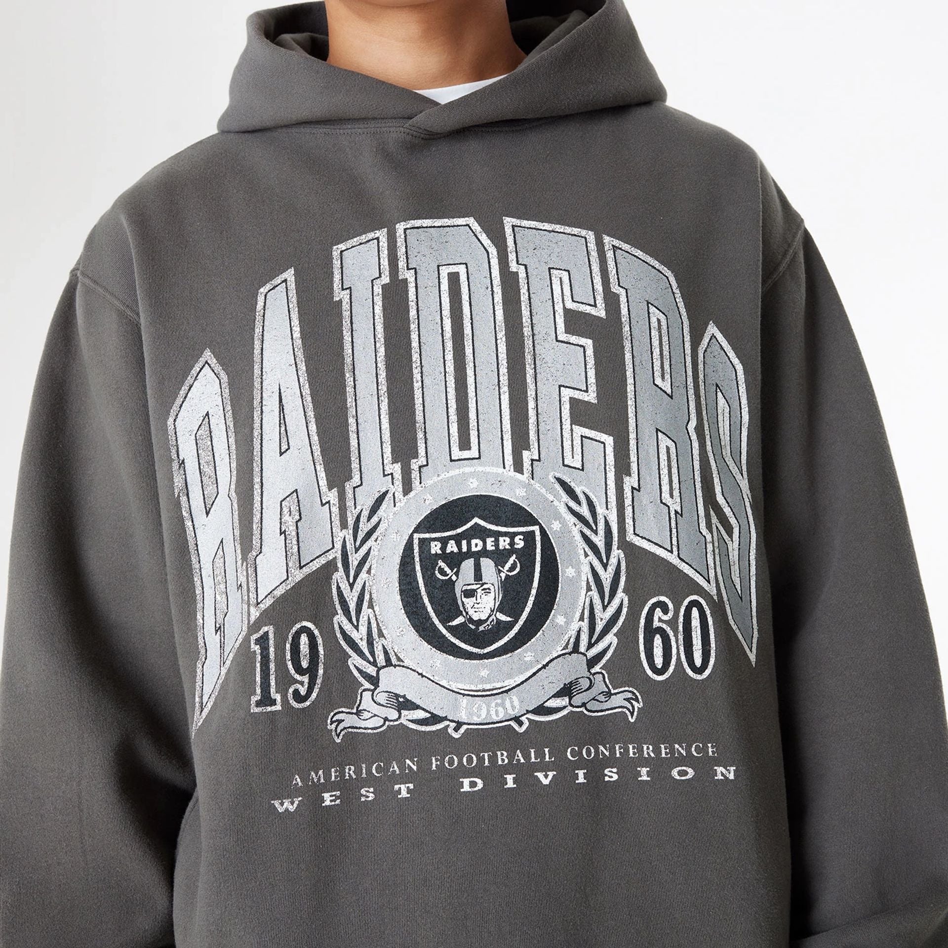 The Male model is wearing Las Vegas Raiders Oversized Essential Dark Grey Oversized Pullover Hoodie 4