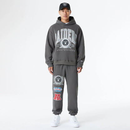 The Male model is wearing Las Vegas Raiders Oversized Essential Dark Grey Oversized Pullover Hoodie 7