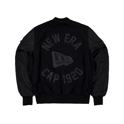 The Male model is wearing New Era x Alpha Industries Black Varsity Jacket 2