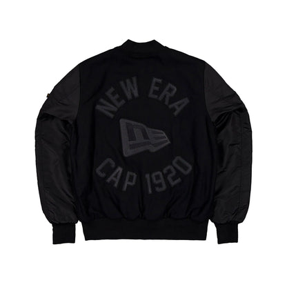 The Male model is wearing New Era x Alpha Industries Black Varsity Jacket 2