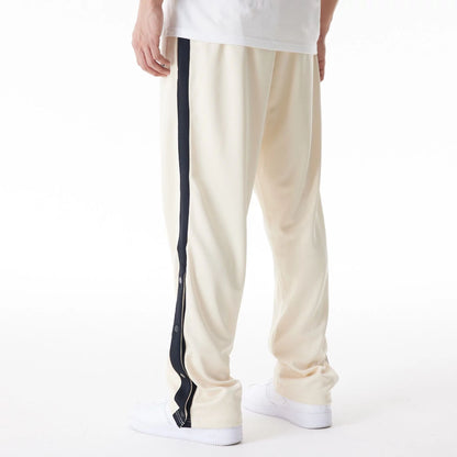 The Male model is wearing Chicago Bulls NBA Lifestyle Light Beige Straight Joggers  4