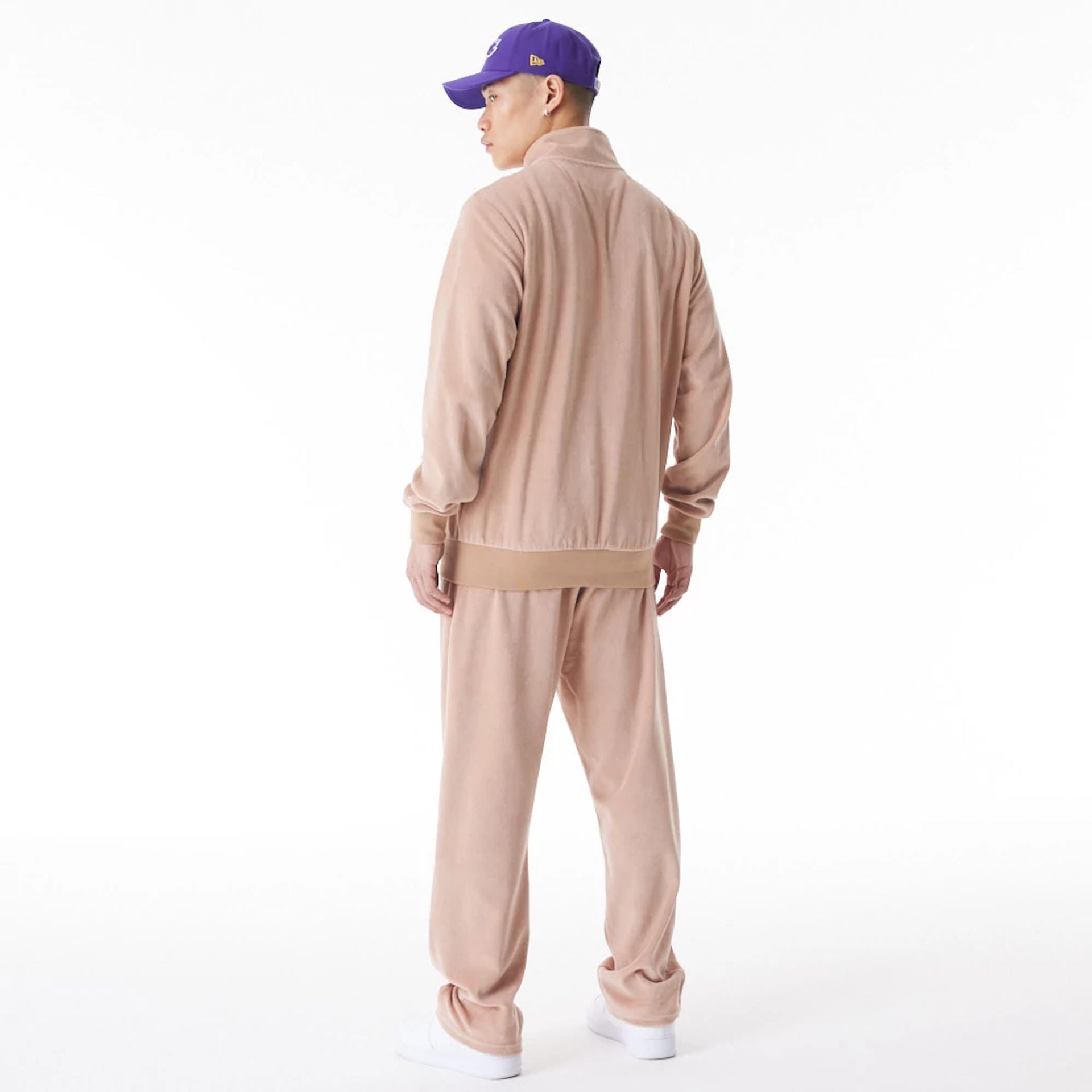 The Male model is wearing LA Lakers NBA Lifestyle Velour Beige Track Jacket  10