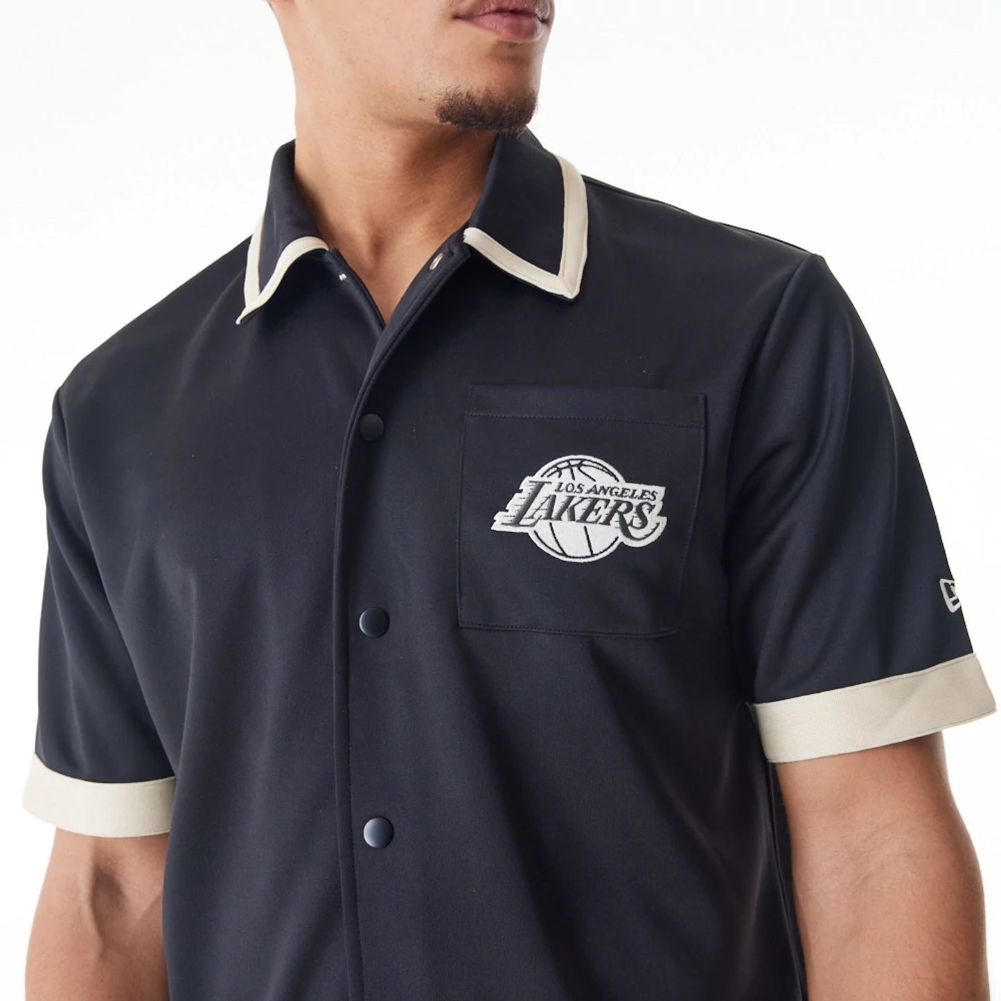 The Male model is wearing LA Lakers NBA Lifestyle Revere Black Short Sleeve Shirt 7