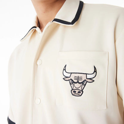 The Male model is wearing Chicago Bulls NBA Lifestyle Revere Light Beige Short Sleeve Shirt 8