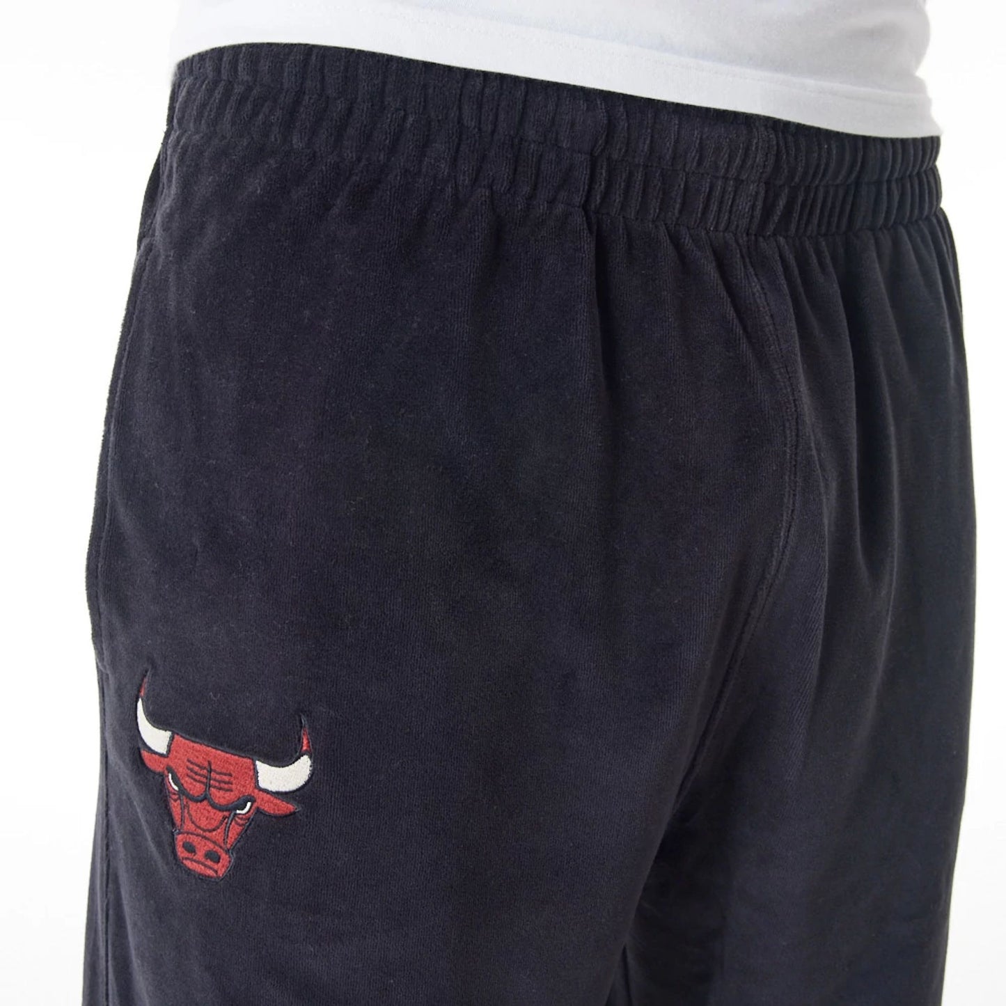 The Male model is wearing Chicago Bulls NBA Lifestyle Velour Black Track Joggers  3