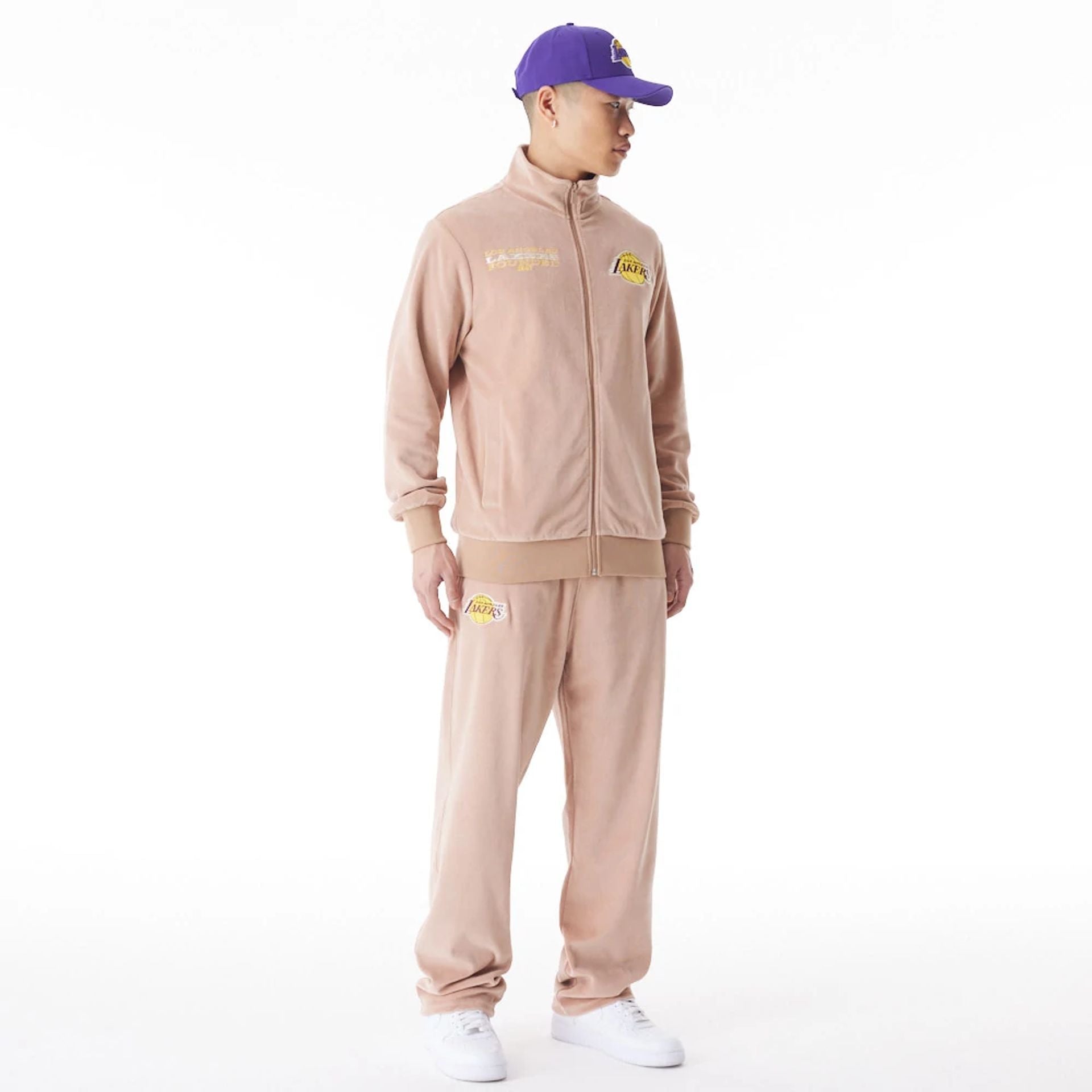 The Male model is wearing LA Lakers NBA Lifestyle Velour Beige Track Joggers  1