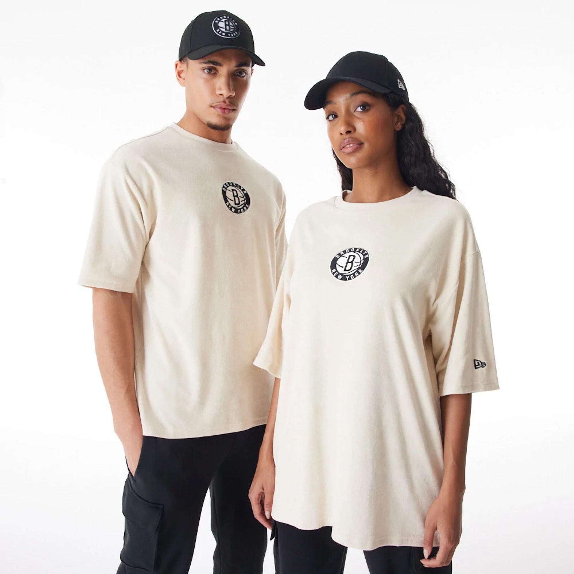 The Male model is wearing Brooklyn Nets NBA Lifestyle Velour Light Beige Oversized T-Shirt  3