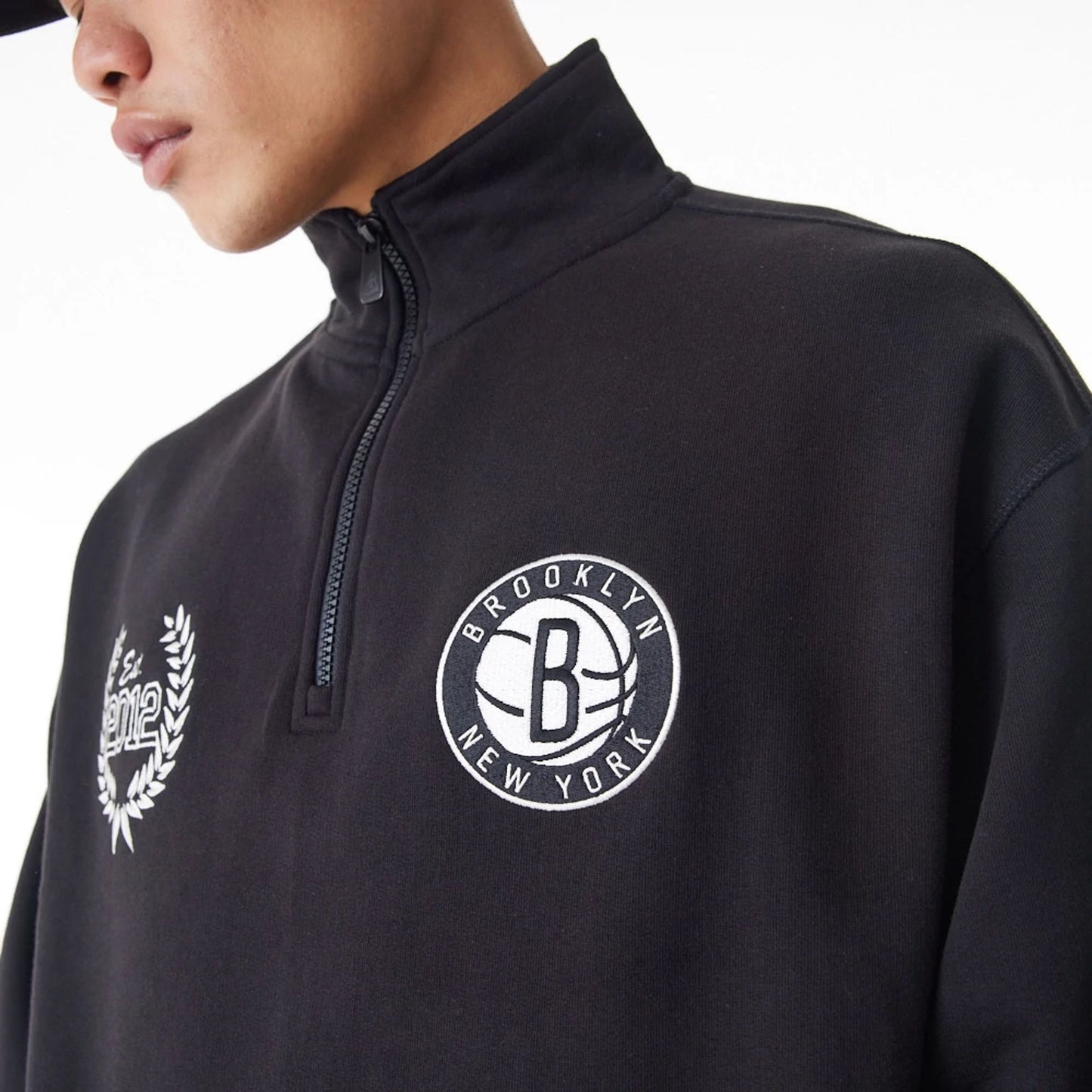 The Male model is wearing Brooklyn Nets NBA Lifestyle Black Quarter Zip Sweater  3