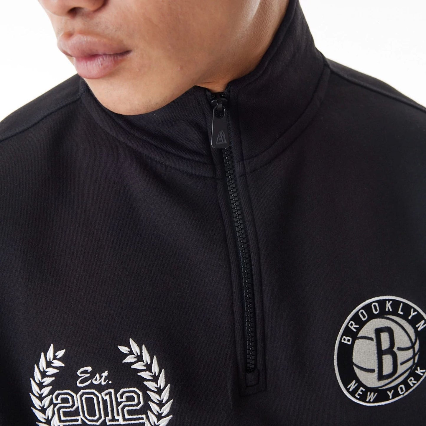 The Male model is wearing Brooklyn Nets NBA Lifestyle Black Quarter Zip Sweater  4