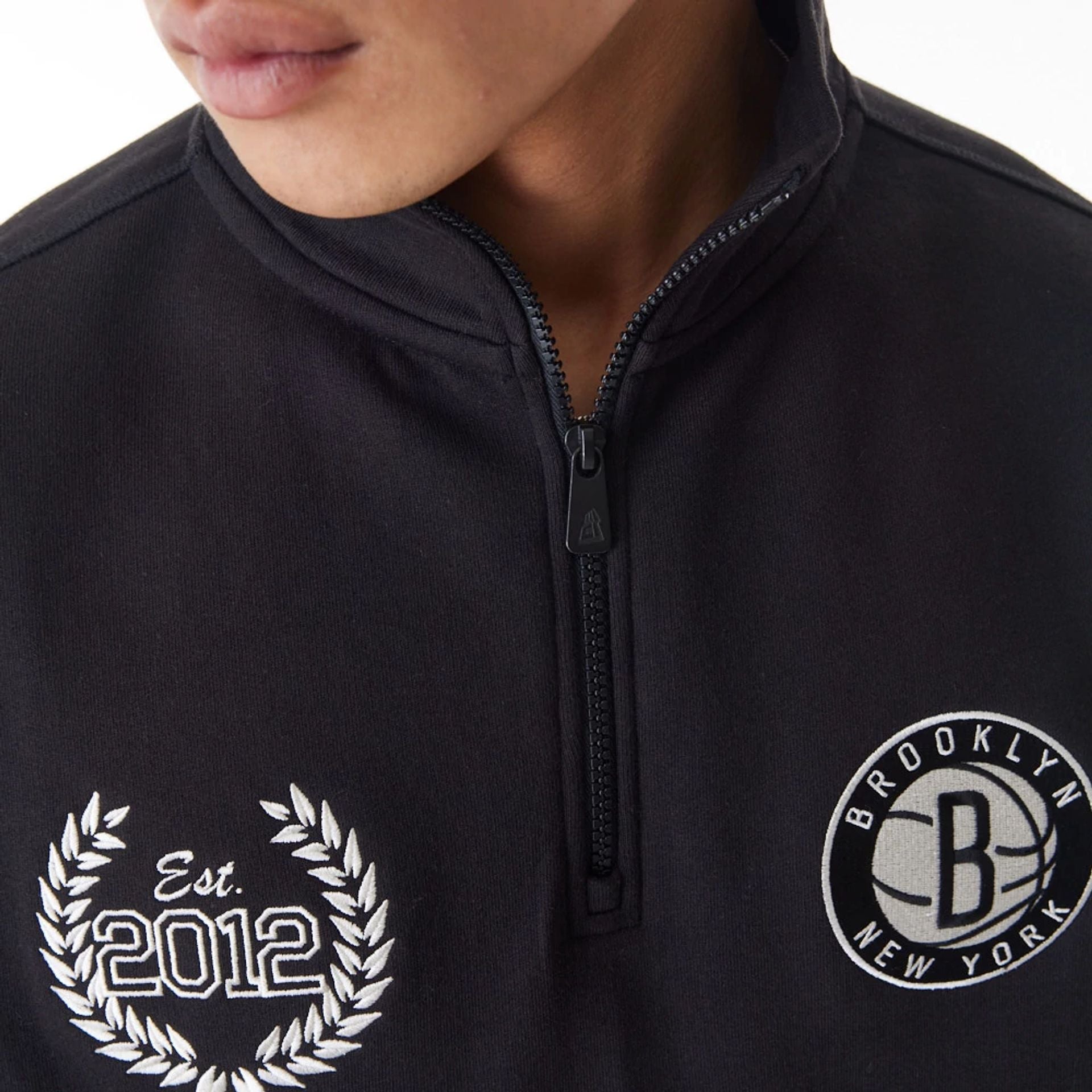 The Male model is wearing Brooklyn Nets NBA Lifestyle Black Quarter Zip Sweater  5