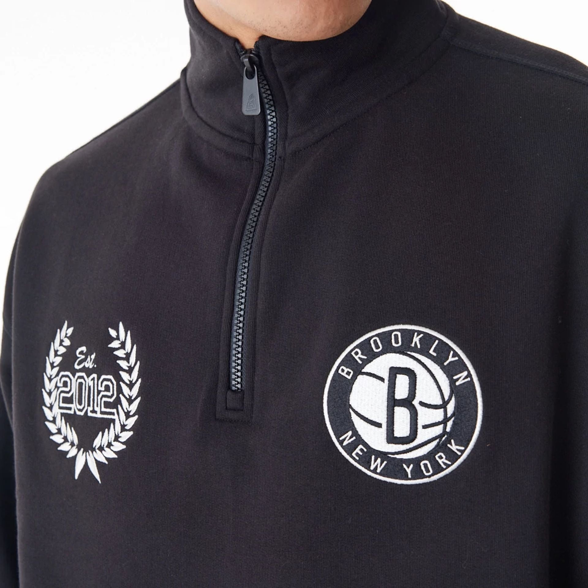 The Male model is wearing Brooklyn Nets NBA Lifestyle Black Quarter Zip Sweater  6