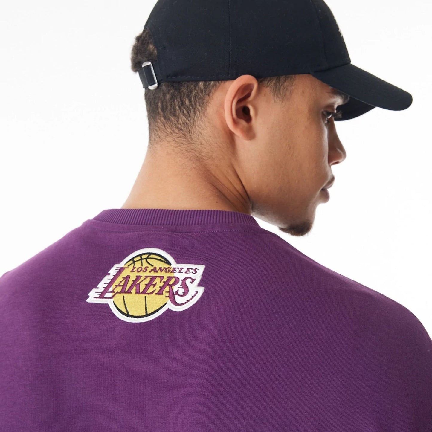 The Male model is wearing LA Lakers NBA Lifestyle Dark Purple Oversized Crew Neck Sweater  4