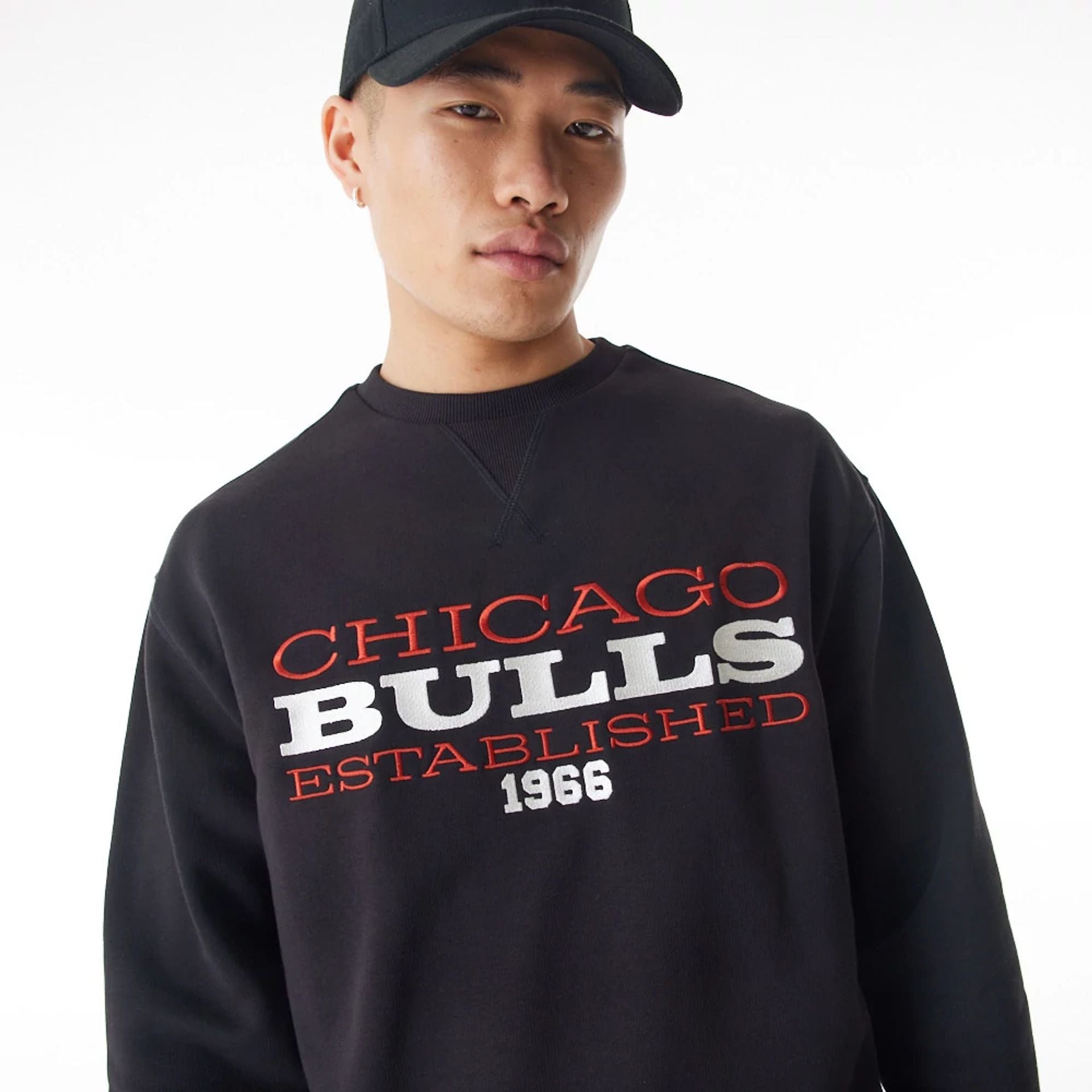 The Male model is wearing Chicago Bulls NBA Lifestyle Black Oversized Crew Neck Sweater  3