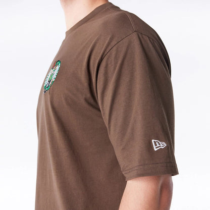 The Male model is wearing Boston Celtics League Essential Dark Brown Oversized T-Shirt  5