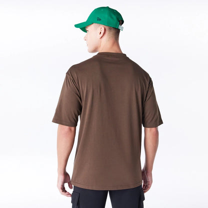 The Male model is wearing Boston Celtics League Essential Dark Brown Oversized T-Shirt  2