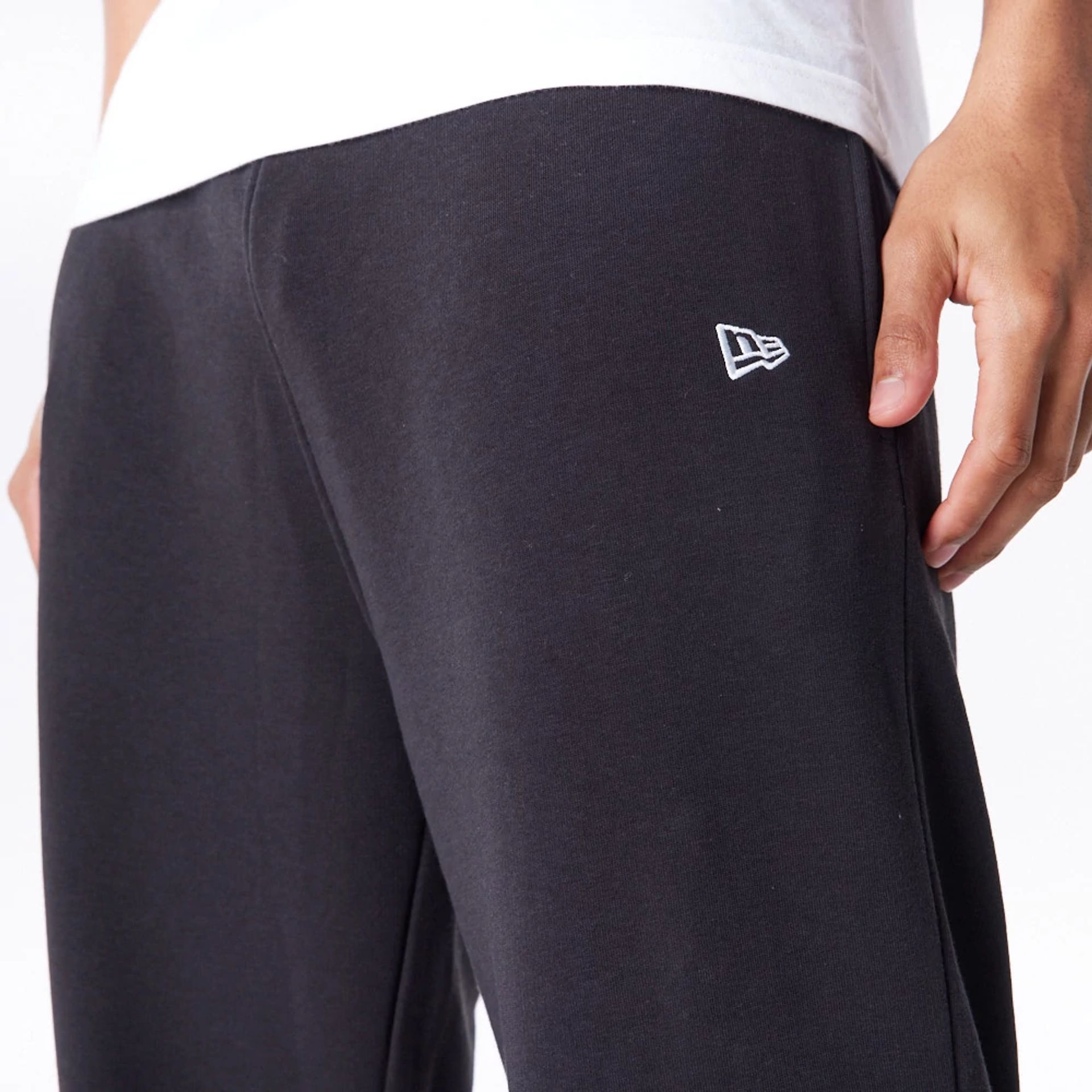 The Male model is wearing Las Vegas Raiders NFL League Essential Black Track Joggers  6