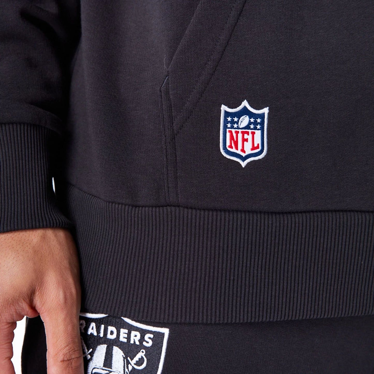 The Male model is wearing Las Vegas Raiders NFL League Essential Black Oversized Pullover Hoodie  6