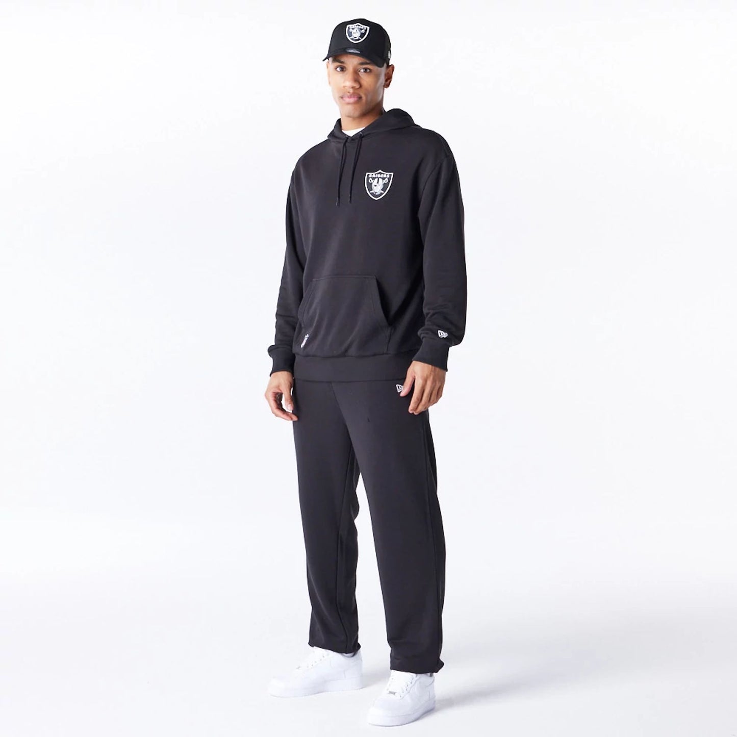 The Male model is wearing Las Vegas Raiders NFL League Essential Black Oversized Pullover Hoodie  4