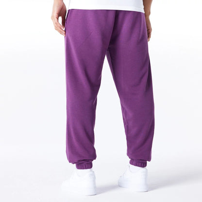 The Male model is wearing Chicago Bulls League Essential Dark Purple Track Joggers  3