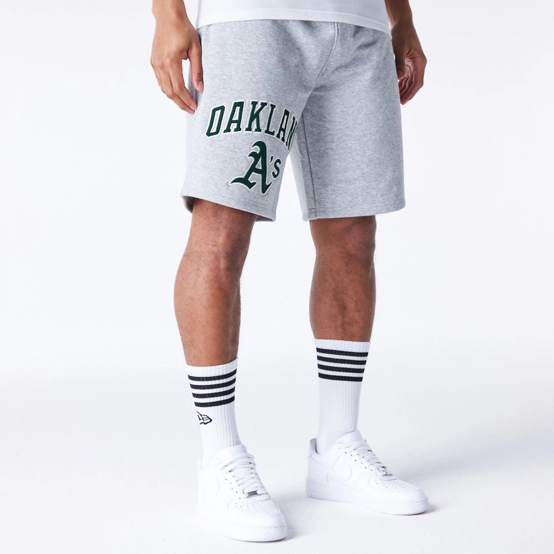 The Male model is wearing Oakland Athletics MLB Lifestyle Grey Shorts  4