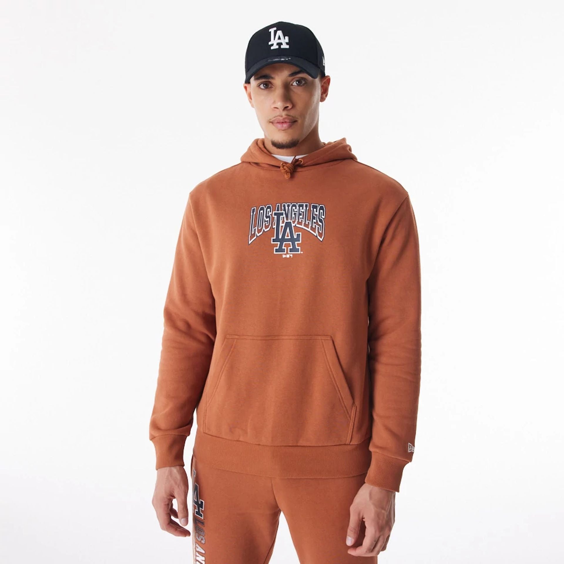 The Male model is wearing LA Dodgers MLB Gradient Brown Oversized Pullover Hoodie  1