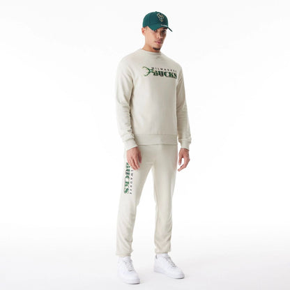 The Male model is wearing Milwaukee Bucks NBA Graphic Cream Crew Neck Sweater  5