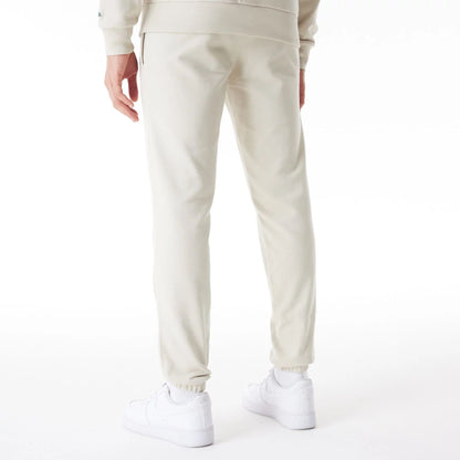 The Male model is wearing Milwaukee Bucks NBA Graphic Cream Joggers  2