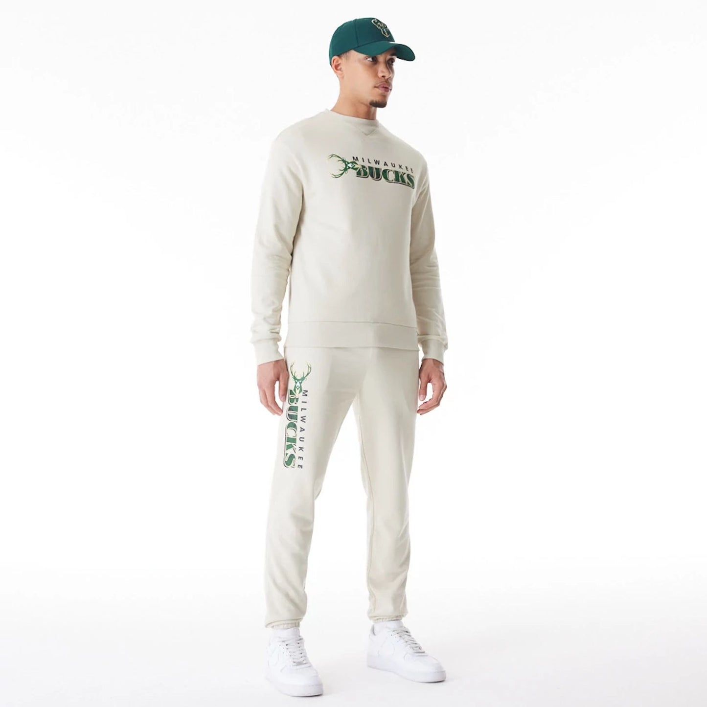 The Male model is wearing Milwaukee Bucks NBA Graphic Cream Joggers  6