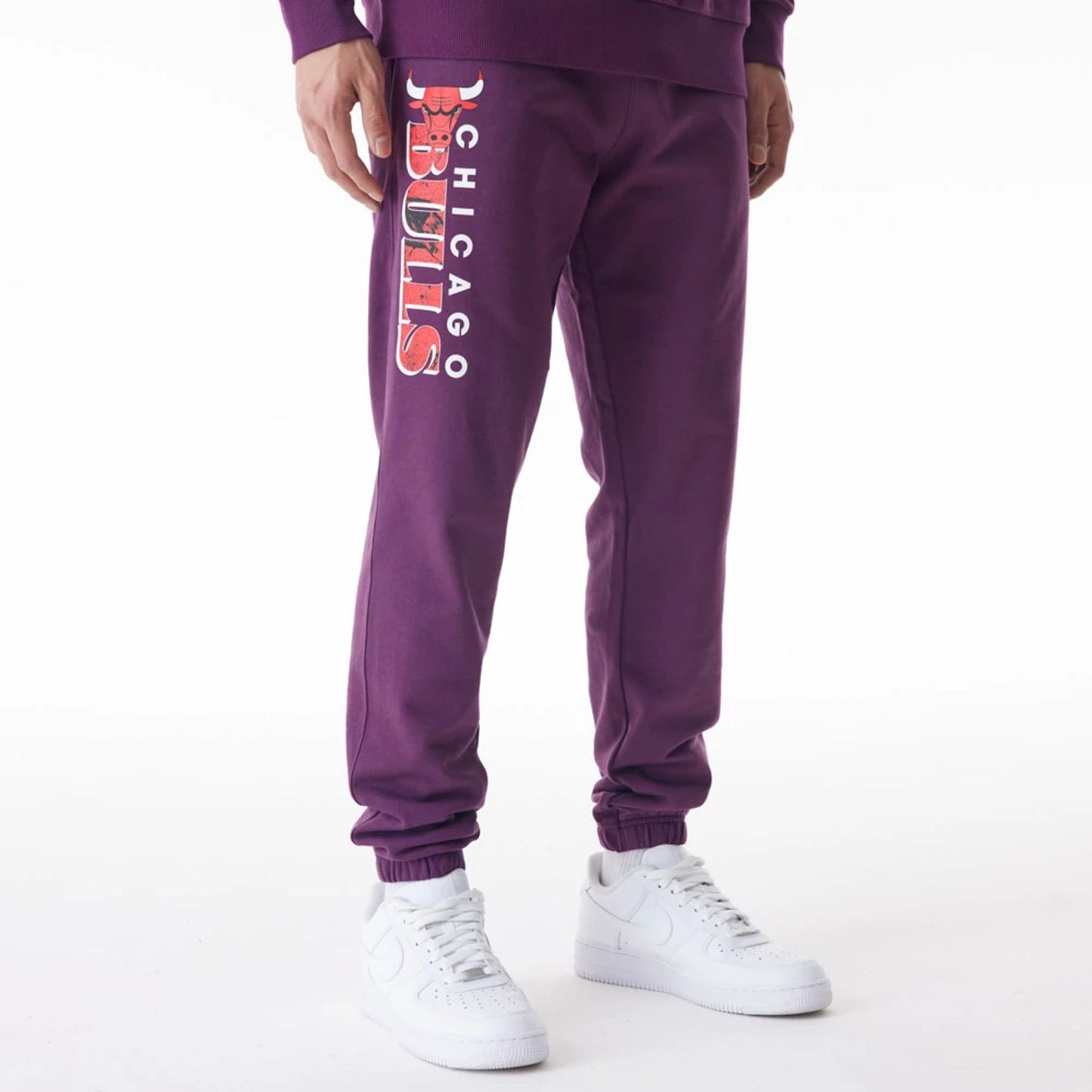 The Male model is wearing Chicago Bulls NBA Graphic Dark Purple Joggers  1