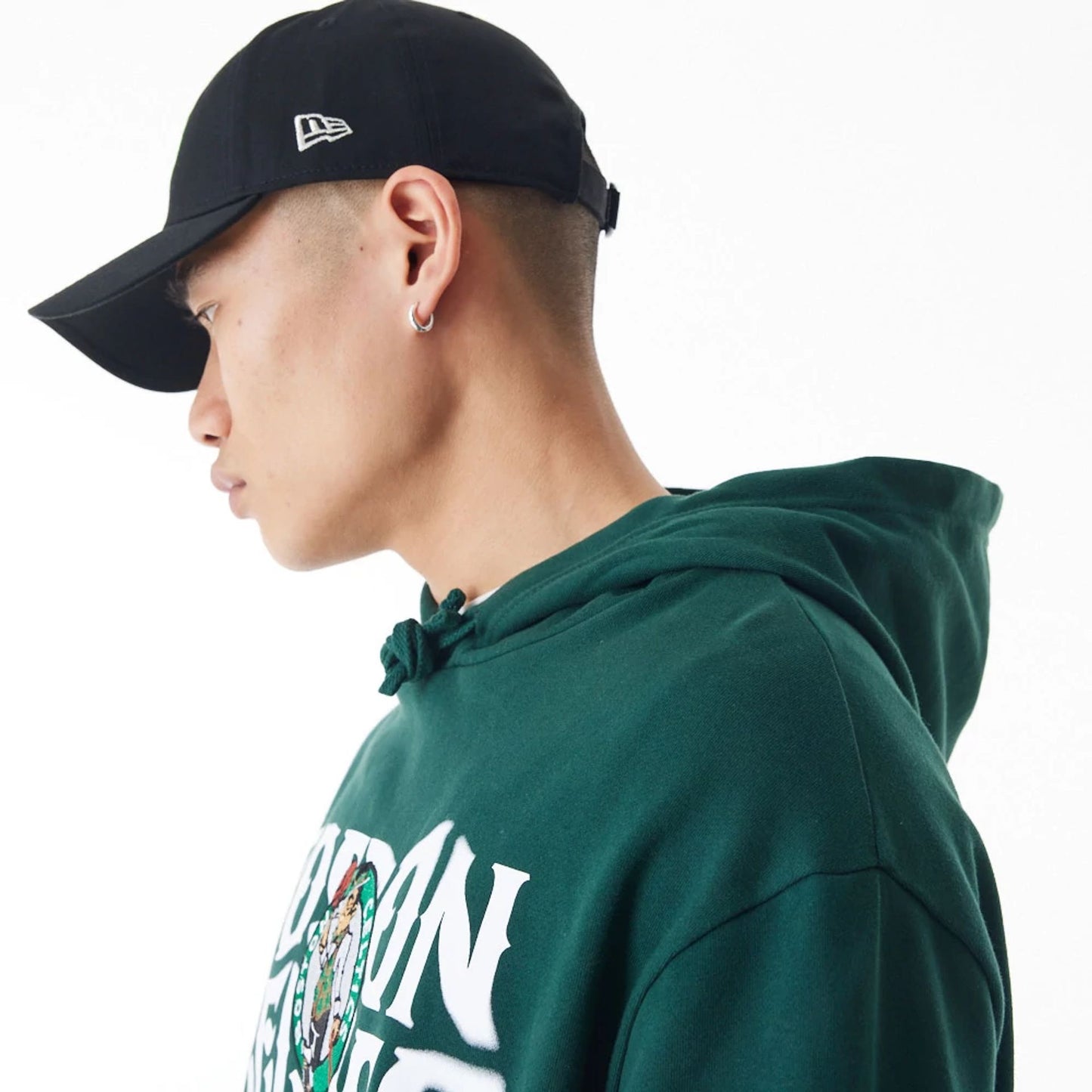 The Male model is wearing Boston Celtics NBA Graphic Dark Green Oversized Pullover Hoodie  8