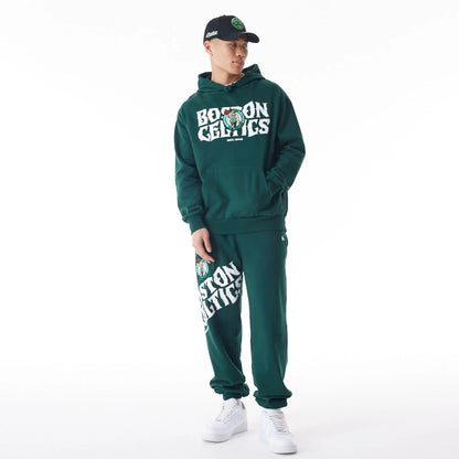 The Male model is wearing Boston Celtics NBA Graphic Dark Green Oversized Pullover Hoodie  5