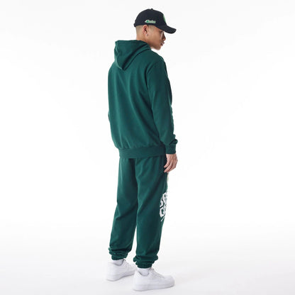 The Male model is wearing Boston Celtics NBA Graphic Dark Green Oversized Pullover Hoodie  3